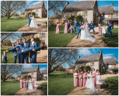 Wedding party posing outside rustic venue in countryside.