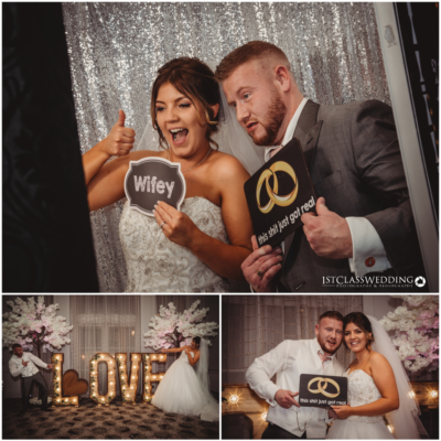 Newlyweds posing with playful signs at wedding.