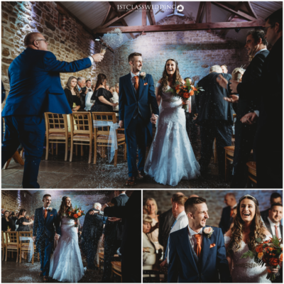 Joyful confetti moment at rustic wedding ceremony.