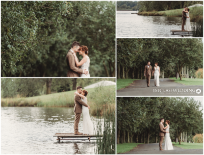 Wedding couple embracing outdoors by lake and path.