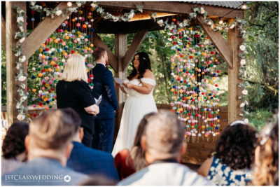 Outdoor wedding ceremony with colorful backdrop