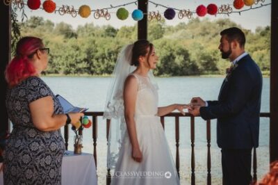 Outdoor wedding ceremony by the lake.