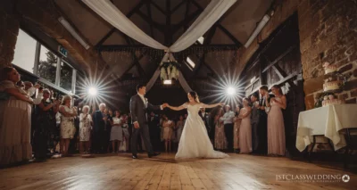 Bride and groom's first dance at rustic wedding venue.