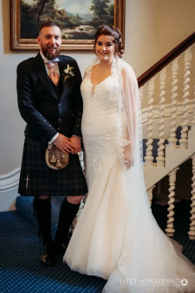 Bride and groom in wedding attire with Scottish kilt.