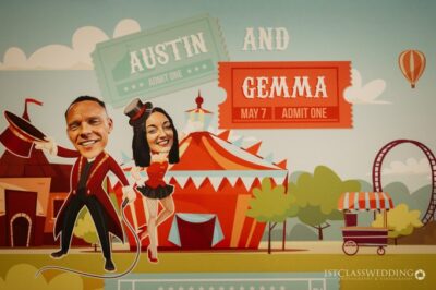 Circus-themed wedding invitation with caricatures of Austin and Gemma.