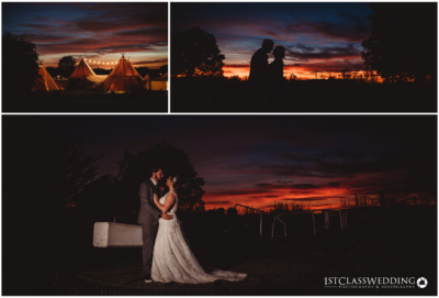 Wedding couple silhouetted against vibrant sunset.