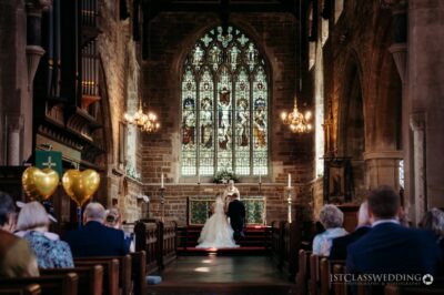 Wedding ceremony in elegant church interior.