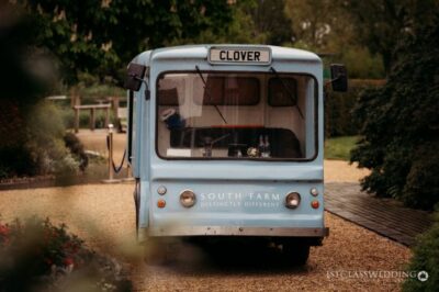 Vintage blue bus labeled "Clover" at South Farm.