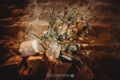 Rustic bridal bouquet on wooden background.