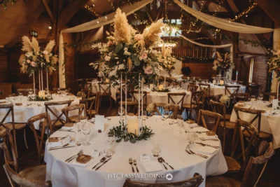 Elegant rustic wedding reception tablescape with floral decorations.