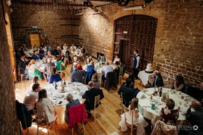 Guests dining at rustic-style wedding reception.