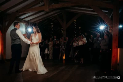 Couple's first dance at rustic wedding venue.