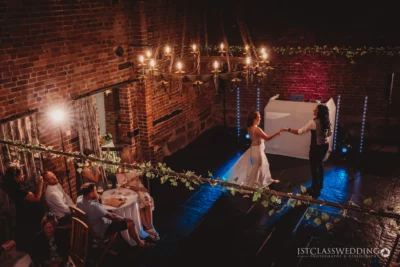 Couple's first dance at a rustic wedding reception.