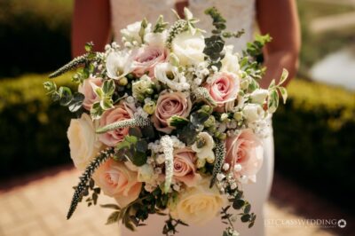 Elegant bridal bouquet with pink and white roses.