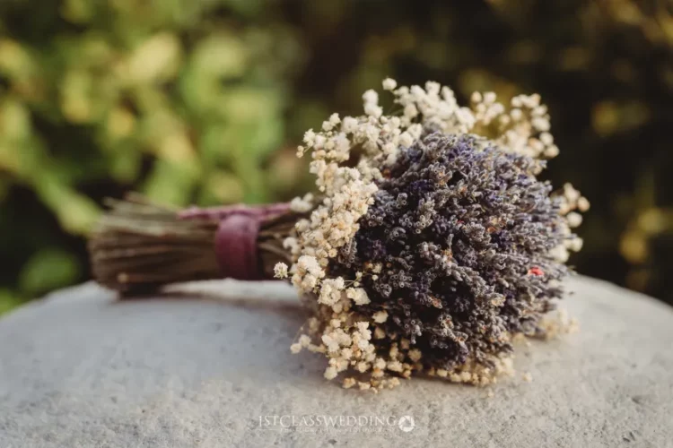 Dried lavender bouquet on stone surface