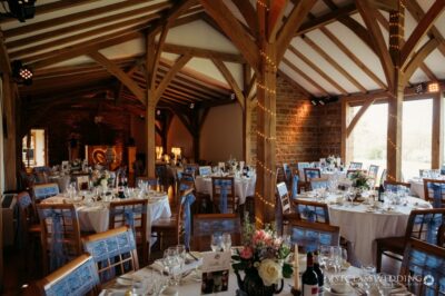 Elegant barn wedding venue decorated for reception.