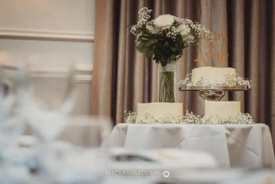Elegant wedding cake on display with floral decoration