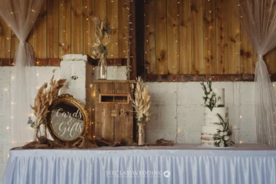 Rustic wedding gift table with cards sign and fairy lights.