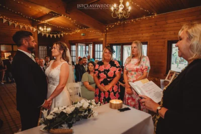 Couple exchanging vows at wedding ceremony.