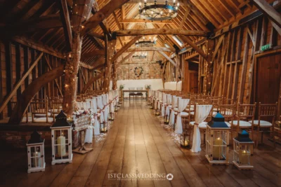 Rustic barn wedding venue interior set for ceremony.