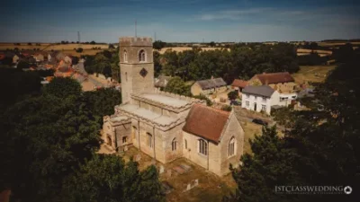 Aerial view of an English village church and surroundings.