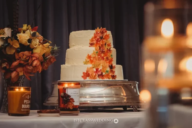 Autumn-themed wedding cake with floral decor.