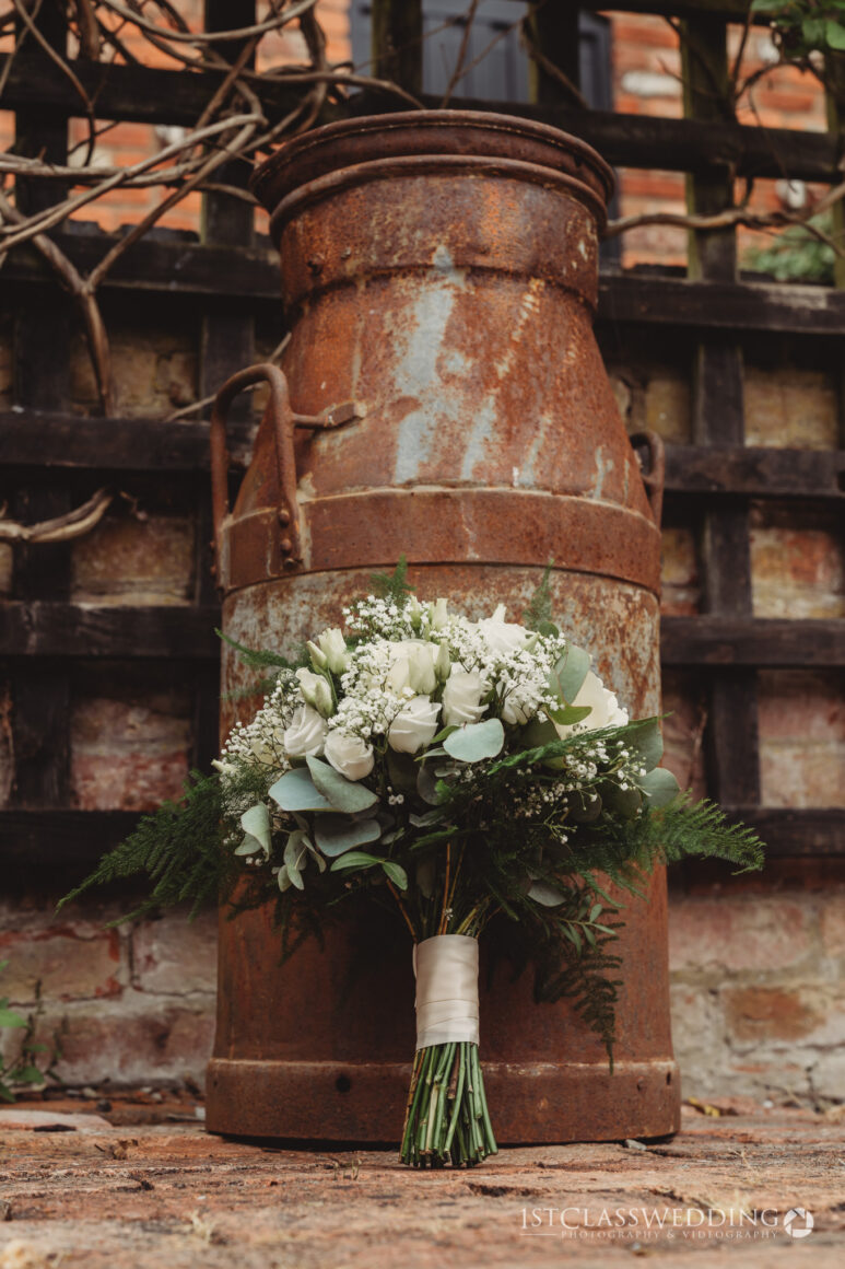 brides bouquets in front of milk churm