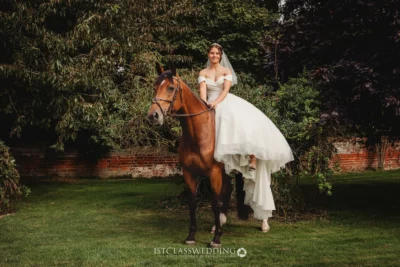 Bride on horse in garden wedding scene.