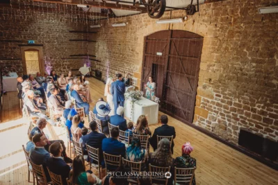Wedding ceremony in rustic barn venue