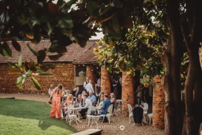 Outdoor wedding reception at rustic brick venue