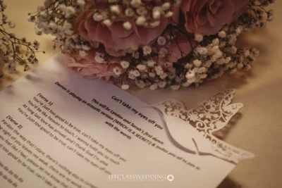 Wedding bouquet beside a song lyrics sheet.