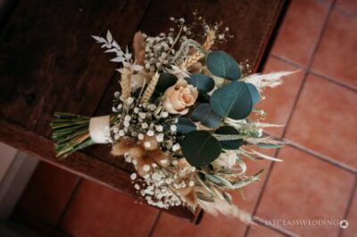 Bridal bouquet on wooden surface