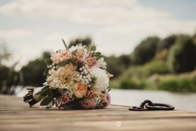 Elegant wedding bouquet riverside with white and pink flowers.