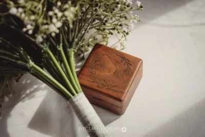 Engraved wedding ring box with bridal bouquet.