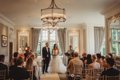 Elegant indoor wedding ceremony with guests.