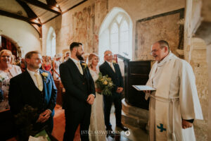 Wedding ceremony in historic church interior.
