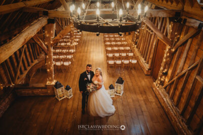 Couple in rustic wedding barn venue.