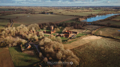 Aerial view of countryside estate with church in UK.