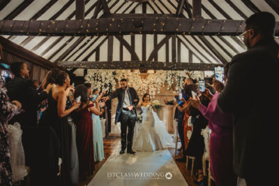 Wedding couple's first dance in timber framed hall
