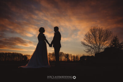 Couple silhouette sunset wedding photography.
