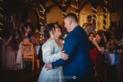 Couple's first dance at twinkling wedding reception.