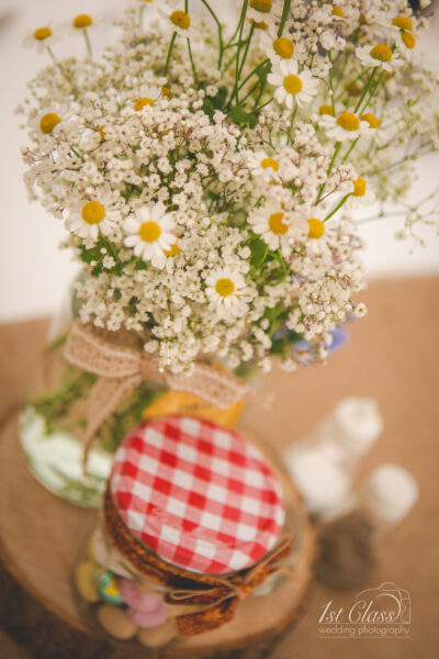 Rustic wedding bouquet on wooden surface.