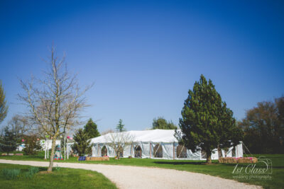 Marquee in sunny countryside setting.