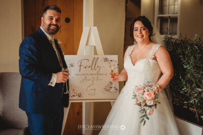 Bride and groom holding welcome wedding sign at Crockwell Farm.