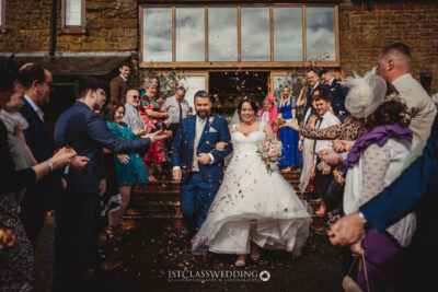 Joyful wedding confetti toss celebration with guests at Crockwell Farm.