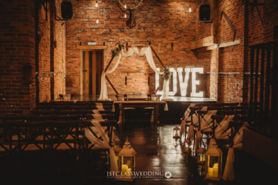 Romantic wedding venue with lighted LOVE sign at Donnigton Park Farmhouse
