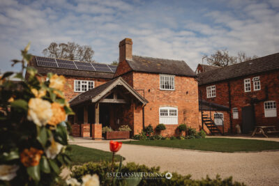 Traditional brick house with solar panels, UK countryside at Donnigton Park Farmhouse