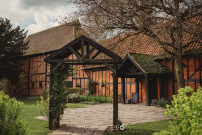 Traditional Tudor-style wedding venue in English garden.