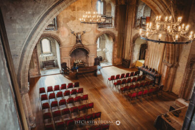 Historic castle hall prepared for a wedding ceremony.