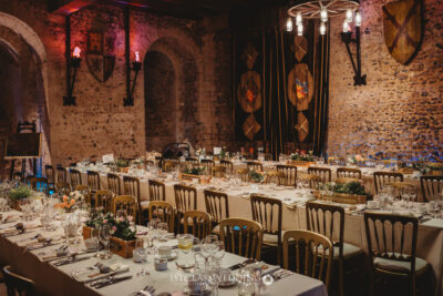 Elegant medieval banquet hall wedding setup.